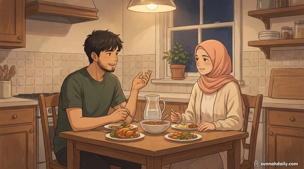 A husband and wife eating together at a small kitchen table in the evening